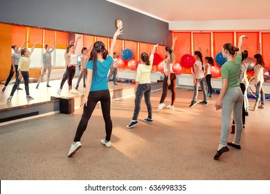Fitness, dancing, sport, training, gym, children healthy lifestyle concept - Group of sportive of teenage girls exercising in the gym