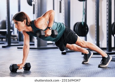 Fitness, dumbbell and push up with a man at gym for a workout, biceps exercise or training. Male athlete person with iron weights for strong muscle, focus and agile performance at wellness club - Powered by Shutterstock