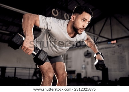 Fitness, dumbbells and man exercise at gym for training workout with focus. Serious male athlete or bodybuilder with weights for strong muscle, power or motivation for hard work and bent over row