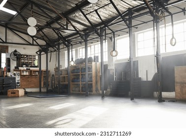 Fitness, empty gym and equipment for exercise, workout and sports for wellness, weightlifting and studio. Health club, interior and recreation center for bodybuilding, training and room for practice - Shutterstock ID 2312711269