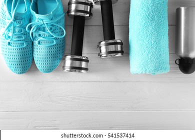Fitness equipment on wooden background - Shutterstock ID 541537414
