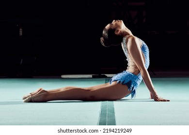 Fitness, Exercise And Gymnastics Woman Stretching In A Gym Studio For A Sports Competition. Strong Girl Athlete Training Acrobat, Balance And Agility Workout Routine For A Creative Competitive Event