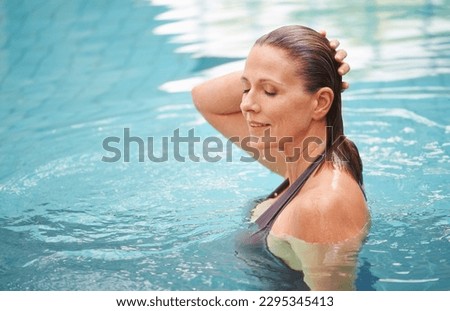 Fitness, exercise and senior woman in a swimming pool, happiness and stress relief with fun. Human, mature female person and lady with joy, training and relax with water sports, workout and chilling