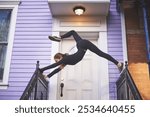 Fitness, flexible woman and yoga at house with stretching, exercise and outdoor with energy. Gymnast, position and pilates in doorway with confidence, movement and balance on railing for creativity