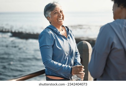 Fitness, funny and happy with senior friends at beach for training, running and relax. Comic, smile and workout with old women laughing in nature for health, happiness and wellness together - Powered by Shutterstock