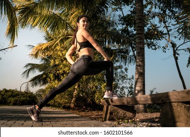 Fitness Girl Doing Standing Hamstring Stretch After A Run In Park Near Hanoi Vietnam