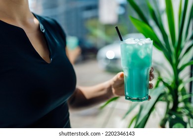 Fitness Girl Holding A Glass With Sports Nutrition Drink