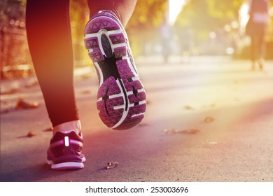 Fitness Girl Running At Sunset In City Center