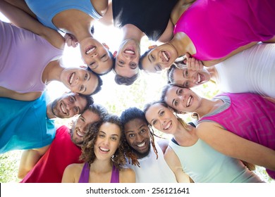 Fitness Group Smiling At Camera In Park On A Sunny Day