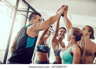 Fitness, gym class and high five with people and personal trainer with workout, exercise and training. Group, smile and happy athlete with success, motivation and excited from sport at health club - Powered by Shutterstock