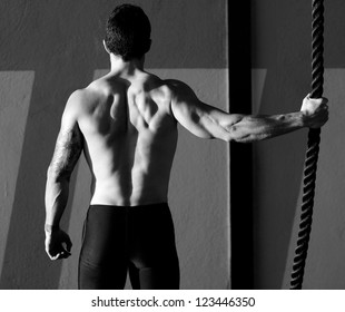 Fitness Gym Man Holding Hand A Climbing Rope Rear View