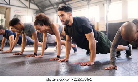 Fitness, gym with men and women doing plank, strong and exercise for muscle, cardio and endurance in workout class. Health, wellness and diversity, body training and healthy active challenge. - Shutterstock ID 2225178861