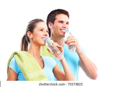 Fitness and gym. Smiling young  strong man and woman. Isolated over white background