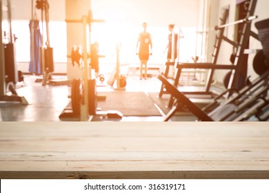 fitness gym and wooden desk space - Shutterstock ID 316319171