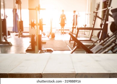 fitness gym and wooden desk space - Shutterstock ID 319888916