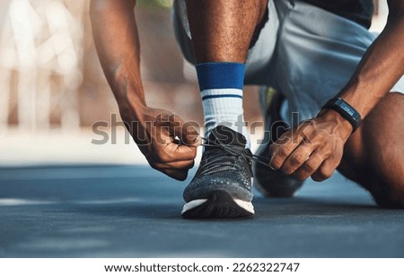 Fitness, hands or black man tie shoes lace before start of running exercise, fitness training or sports workout. Health, wellness and legs of marathon runner, athlete or person prepare for cardio run