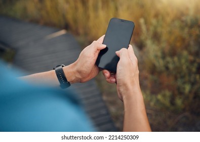 Fitness, Hands And Mockup Phone Screen Of Runner Exercising In Nature. Technology, Digital Tracking And Man Using Smartphone Doing Training Exercise, Workout And Running On Mountain With Smart Tech