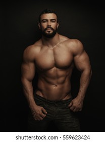 Fitness Handsome And Shirtless Man Standing On Black Background