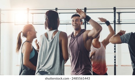 Fitness, high five or motivation and coach with students in gym for congratulations or support. Goals, success or target and personal trainer in celebration with class of people for exercise routine - Powered by Shutterstock