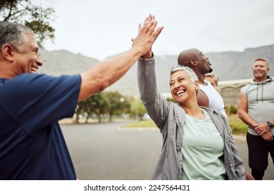 Fitness, high five and senior people or friends with support, accountability and teamwork in nature training, exercise or workout. Wellness, community and old couple with target, success or goal sign - Powered by Shutterstock