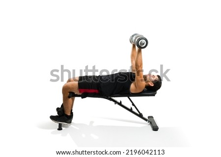 Fitness hispanic man lifting dumbbell weights and exercising doing a bench press isolated on a white background