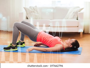 fitness, home and diet concept - smiling teenage girl doing exercise for legs and buttocks on floor at home