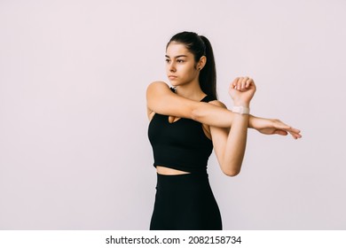 Fitness, Home And Diet Concept - Smiling Young Woman Streching Hands At Home