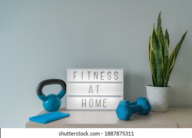 Fitness At Home Light Sign With Kettlebell Weight And Dumbells, Resistance Bands For Pilates Online Class. Exercise Indoors For Women.