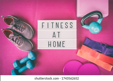 Fitness At Home Sign With Pink Yoga Mat, Running Shoes, Kettlebell Weight And Dumbells Resistance Bands And Sliders For Pilates Online Class. Exercise Indoors For Women.