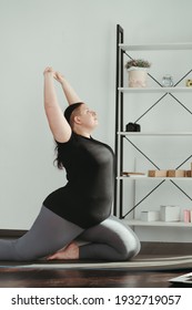 Fitness, Home Training, Online Yoga Class. Overweight Woman Practicing Yoga At Home. Stretching Exercise For Cool Down And Relax