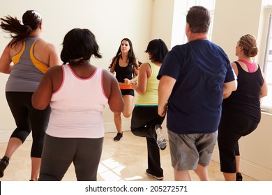 Fitness Instructor In Exercise Class For Overweight People