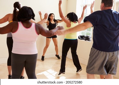 Fitness Instructor In Exercise Class For Overweight People