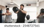 Fitness, kettle bell and men in gym with weights for bodybuilding training, exercise class and intense workout. Sports, serious and people with equipment for muscle strength, health and challenge