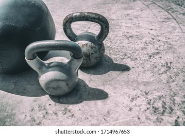 Fitness kettlebells weights gym background. Free kettlebell weight and medicine ball training workout outdoor place. Kettlebells heavy weight for weightlifting cross training. - Powered by Shutterstock