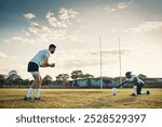 Fitness, kicking and rugby with team of people outdoor on field together for competition or challenge. Ball, goal and training with sports player group on grass for exercise, game or match practice