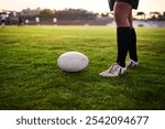 Fitness, legs and ball for rugby, outdoor and performance for game, stadium and kick for competition. Professional, athlete and person with goals, campion and feet for match, cardio and football