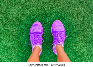 Fitness Lifestyle Active Girl Top View Of Running Shoes Woman Standing On Grass. Pov Selfie Of Feet During Exercise Run Workout Outdoors. Sport Footwear.