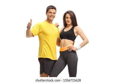 Fitness male and female making a thumb up gesture isolated on white background