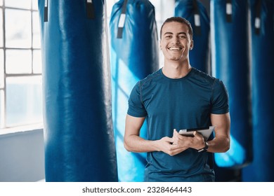 Fitness, man and gym coach with tablet ready for exercise class and training with a smile. Young male person, athlete and wellness center for personal trainer happy from workout with digital app - Powered by Shutterstock