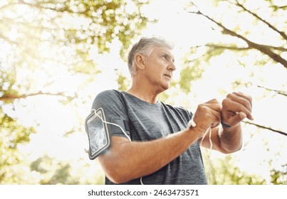 Fitness, mature man and smart watch for time, tracking steps and exercise for wellness or health. Sports, senior male person and mobile for workout metrics, heart performance and running app - Powered by Shutterstock