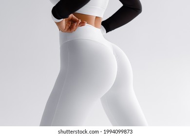 Fitness Model In Leggings With Beautiful Buttocks. 