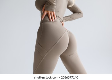 Fitness model in leggings with beautiful buttocks. Sporty booty - Shutterstock ID 2086397140