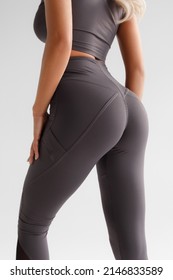 Fitness model in leggings with beautiful buttocks. Sporty booty - Shutterstock ID 2146833589