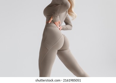 Fitness model in leggings with beautiful buttocks. Sporty booty - Shutterstock ID 2161985051