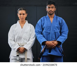 .Fitness, motivation and discipline karate training with a student and teacher standing proud in a center or dojo. Young woman learning defense, strength and endurance lesson from martial arts coach - Powered by Shutterstock