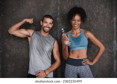 Fitness, muscle flex and portrait of couple in city after workout, body builder training and exercise. Sports, water bottle and man and woman sweating after running for endurance, wellness and energy - Powered by Shutterstock