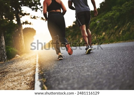 Fitness, nature and people running in road for outdoor race or marathon training in mountain. Sports, friends and back of athletes with cardio workout for endurance exercise in street for practice.