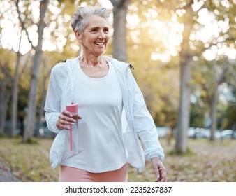 Fitness, nature and senior woman with water bottle for wellness, hydration and minerals for walking in park. Health, retirement and elderly female doing workout, exercise and cardio training outdoors - Powered by Shutterstock