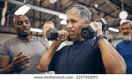 Fitness, old man with dumbbell and help from coach or personal trainer with weight lifting, strength and gym in retirement. Health, exercise and workout at senior sports club and coaching grandpa.