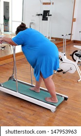 Fitness - Overweight Woman Running On Trainer Treadmill